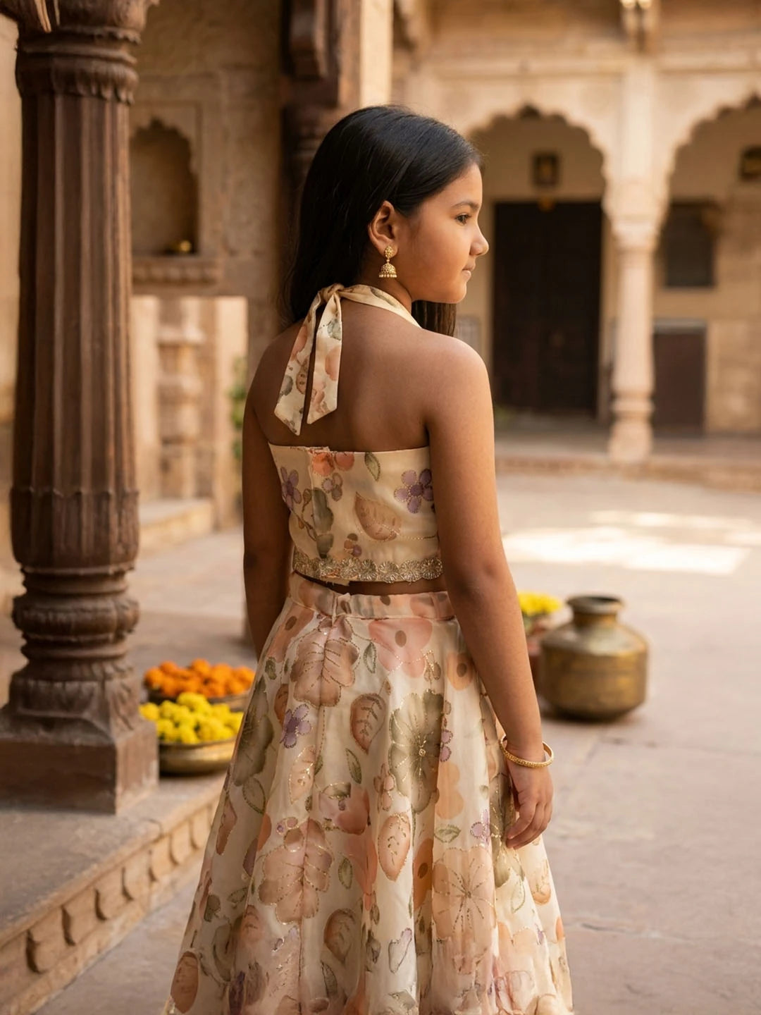 Lehenga with halter neck blouse. Fabric embroidered Jimmy chhoo