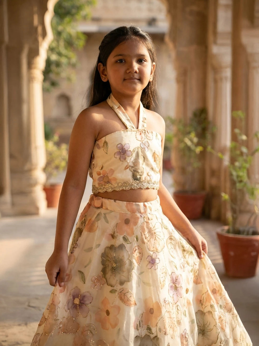 Lehenga with halter neck blouse. Fabric embroidered Jimmy chhoo