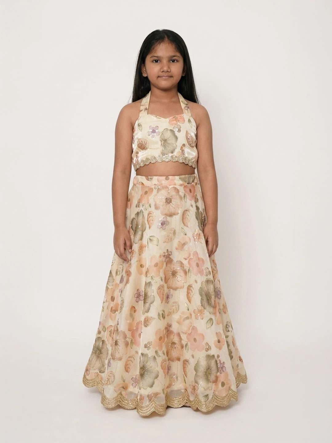 Lehenga with halter neck blouse. Fabric embroidered Jimmy chhoo